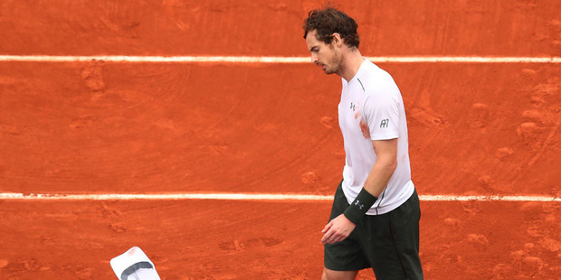 Andy Murray of Great Britain throws his hat following his defeat during the Men's Singles final match against Novak Djokovic. Photo / Getty Images.