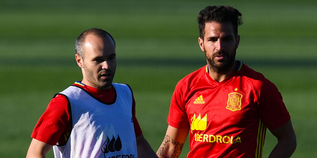 Andres Iniesta (L) and Cesc Fabregas of Spain in action during a training session at La Ciudad Del Futbol de las Rozas. Photo / Getty Images