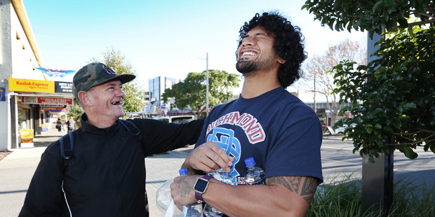 James Gavet (right) with Shaun Paul, a recipient of a food parcel. Photo / Doug Sherring