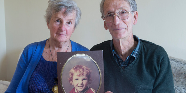 Dave and Marlena Peacock with a portrait of their son Ashley, who has spent more than five years locked in virtual seclusion at a mental health unit. Photo / Mark Mitchell