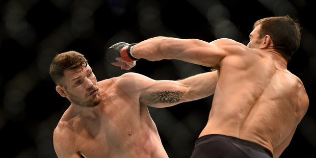 Michael Bisping, left, fights Luke Rockhold during a UFC 199 at the Forum in Inglewood, Calif., Saturday June 4, 2016. Photo / AP.