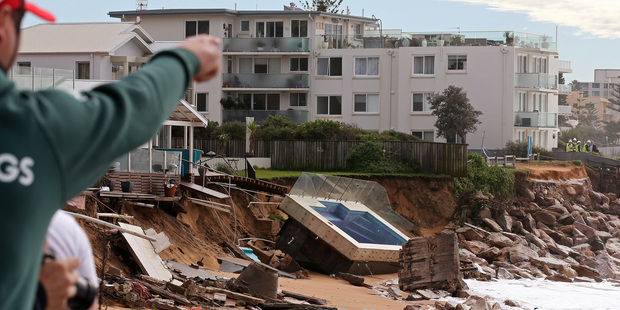 A swimming pool is dislodged and lays on a beach after storms undermined the pilings at Collaroy in Sydney, Photo / AP