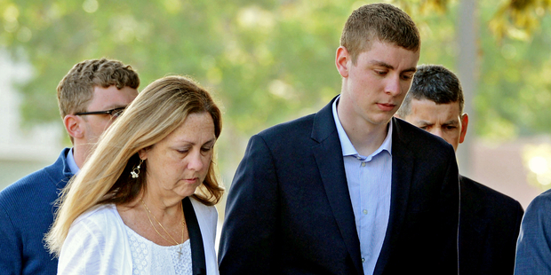 Brock Turner, right, makes his way into the Santa Clara Superior Courthouse in Palo Alto, California. Photo / AP