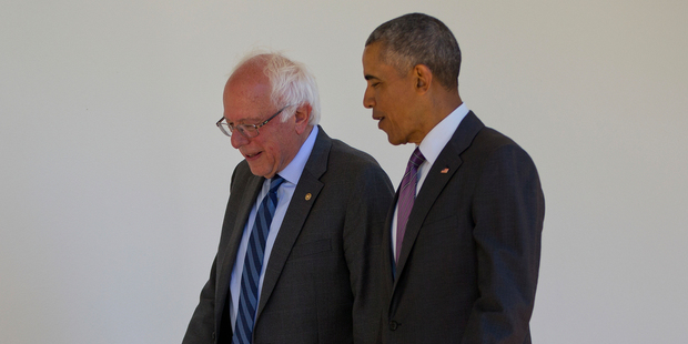 President Barack Obama walks with Democratic presidential candidate Sen. Bernie Sanders down the Colonnade of the White House in Washington. Photo / AP