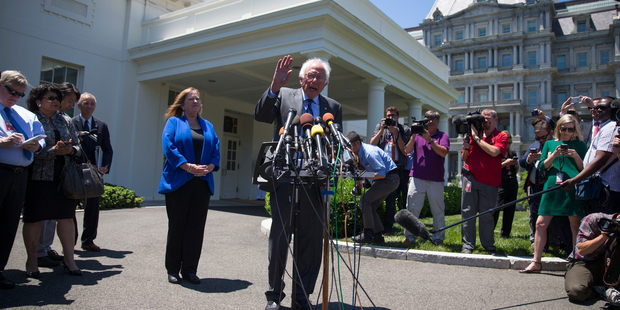 Bernie Sanders, accompanied by his wife Jane Sanders, speak to reporters outside the White House in Washington. Photo / AP