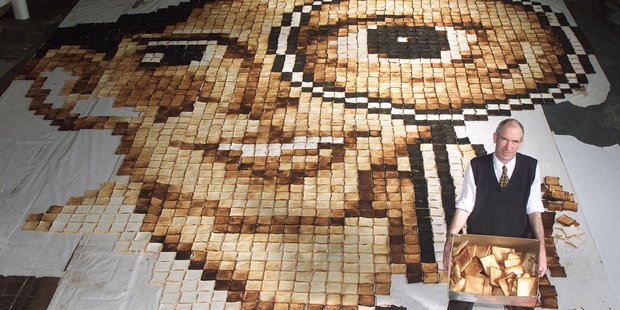 Maurice Bennett with a mock-up of his latest work made from toast slices in Wellington in 2001. Photo / Mark Mitchell