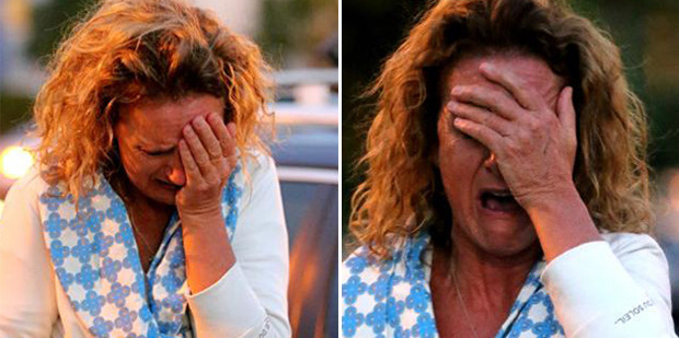 Resident Zara Silk nearly collapses when she sees her home. Photo / News Corp Australia