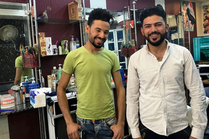 Arkan Ismael and Mohammed Sultan at the Hajar barbershop. Photo / Washington Post