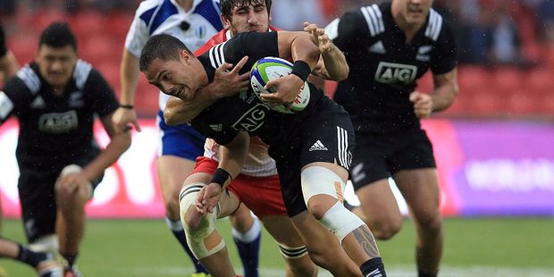 Sam Nock of New Zealand is tackled by Giorgi Tsutskiridze of Georgia during a World Rugby U20 Championship match. Photo / Getty