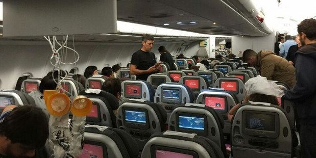 Images of injured people standing by their seats, oxygen masks hanging from the ceiling and panels snapped and dented, emerged online following the incident. Photo / TrafficAirColom Twitter