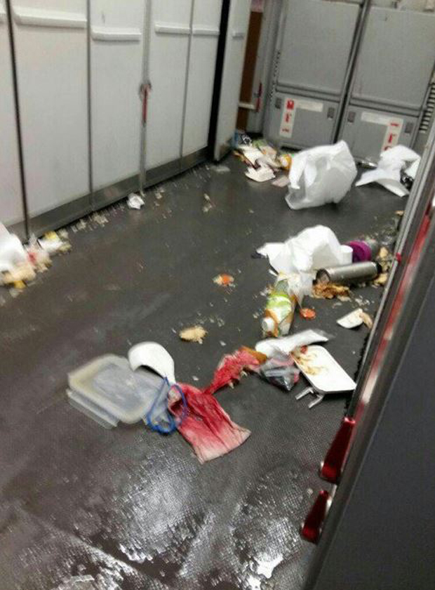 Blood-stained tissue sits among food and containers that were thrown from their positions during the violent turbulence. Photo / TrafficAirColom Twitter