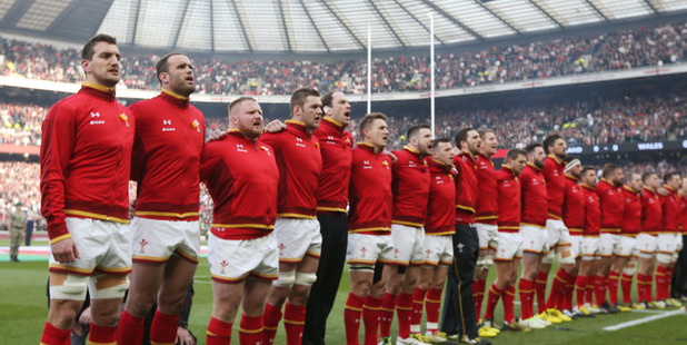 Wales players stand for their anthem ahead of a clash against England. Photo / Getty