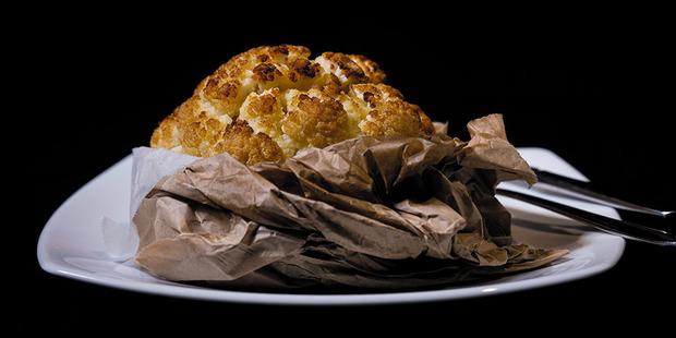 The fourth course - cauliflower presented in a brown paper bag. Photo / Dean Purcell