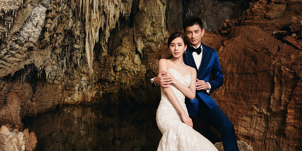 Nicky Wu and Liu Shishi chose to get pre-wedding photographs taken at the Waitomo Glowworm Caves. Photo / Liu Zongyuan