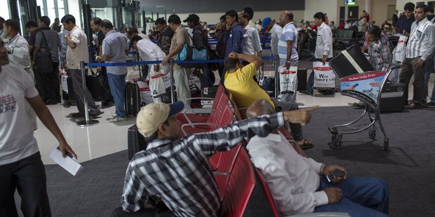 Passengers waiting to board their plane at Dubai International Airport. Photo / Getty