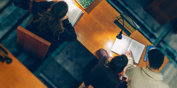 Group of Students Studying in a Library