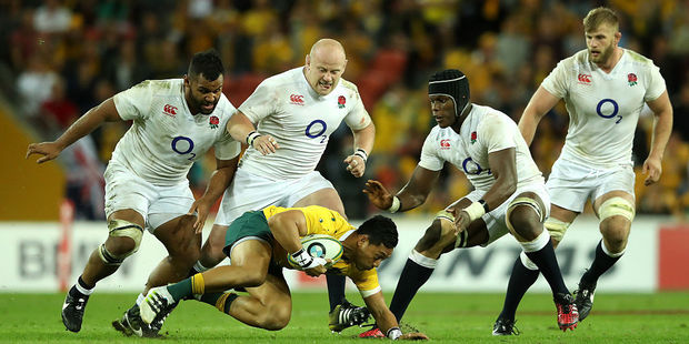 Christian Lealiifano of Australia is smothered by the England defence during the test match between England and Australia on June 11, 2016. Photo / Getty