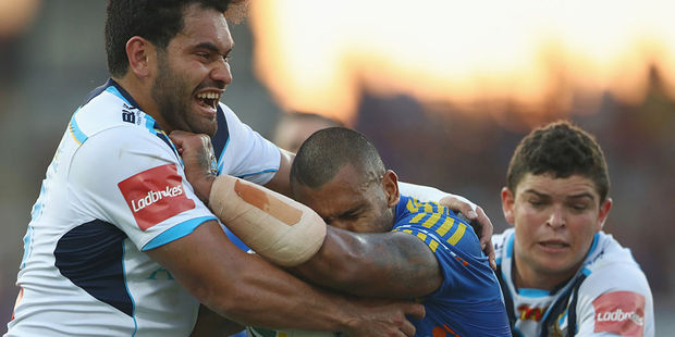 Konrad Hurrell attempts a tackle in the Titans' loss to the Eels. Photo / Getty