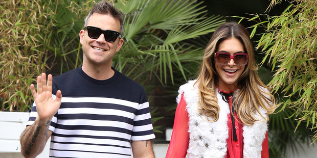 Robbie Williams and Ayda Field are all smiles now, but she's dishing the dirt on his disgusting habits. Photo / Getty Images