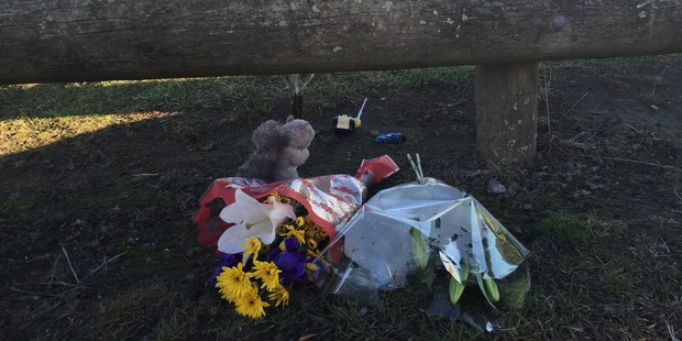 Flowers and toys have been laid at Cowles Stadium carpark in Christchurch where a 2-year-old boy was run over and killed last night. Photo / Kurt Bayer