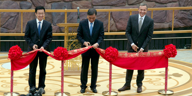 Shanghai Mayor Han Zheng, left, Chinese Vice Premier Wang Yang, center, and Disney CEO Bob Iger at the opening ceremony. Photo / AP
