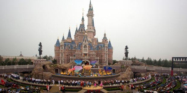 Performers take to the stage during the opening ceremony of Shanghai Disneyland. Photo / AP
