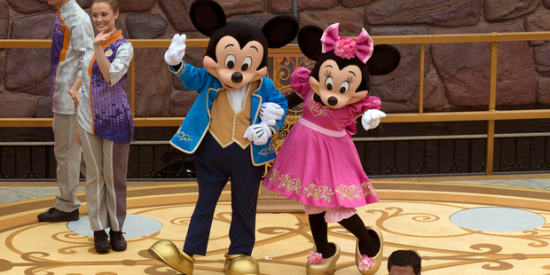 Mickey and Minnie Mouse pose for a photograph. Photo / AP