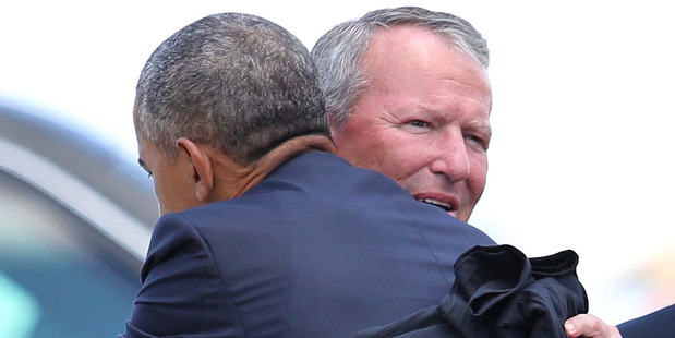 Orlando Mayor Buddy Dyer gets an embrace from President Barack Obama at Orlando International Airport. Photo / AP