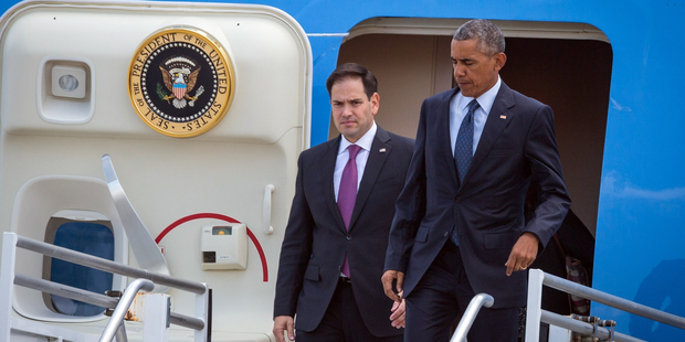 President Barack Obama, right, and Senator Marco Rubio, left, get off Air Force One at Orlando International Airport in Orlando, Florida. Photo / AP
