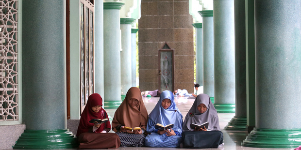 Muslim women read the Quran in Indonesia. Photo / AP