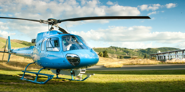 The Lodge at Kinloch, Lake Taupo. Helicopter at the Clubhouse.