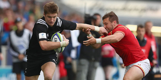 Jordie Barrett of New Zealand holds Billy McBryde of Wales. Photo / Getty