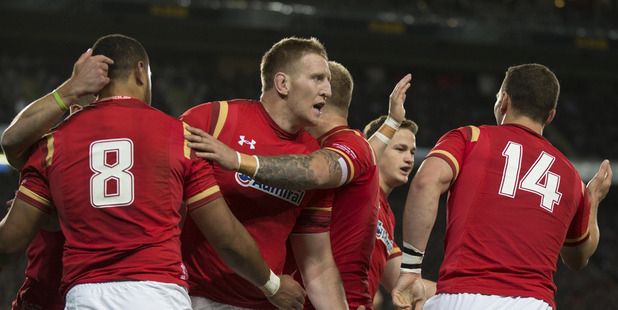 Welsh Number 8 Taulupe Faletau celebrates with his team after scoring the first try against the All Blacks. Photo / Nick Reed
