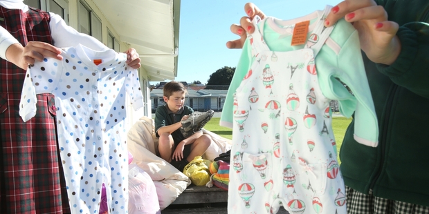 Pupils from St Mary's Catholic School have collected donations of baby clothes, bedding and other items for struggling families at Merivale School. Pictured is Max Forsythe. Photo / John Borren
