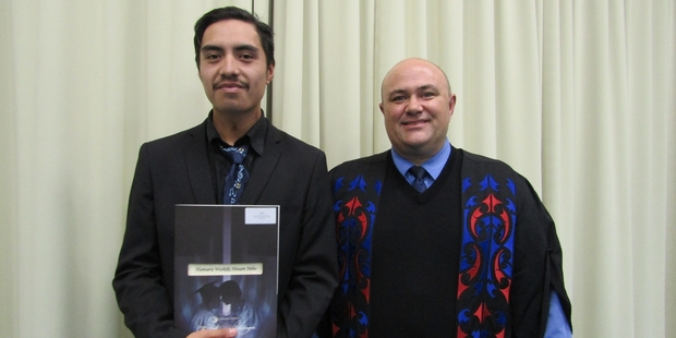 INSPIRED: Hemuera Waikiki Henare Neho, 17, from Kaikohe (left) receives his Diploma in Sport and Fitness from Matiu Payne, director of Te Wananga o Aotearoa.