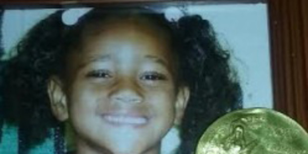 A photo of Chloe D. Smith with the medal she found. Photo: Charlmonique Cunningham / Washington Post
