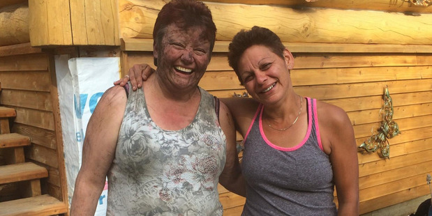 Joanne Barnaby, left, is reunited with Tammy Caudron after hours in the Canadian bush. Photo / Courtesy of Joanne Barnaby