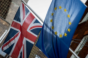 Flags fly outside Europe House, the European Parliament's British offices, in central London, with European flag, right, and Britain's Union flag. Photo / AP