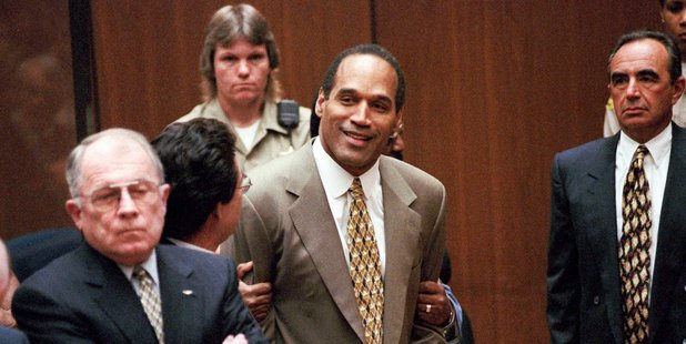 OJ Simpson celebrates after being found not guilty at his 1995 murder trial. Photo/AP