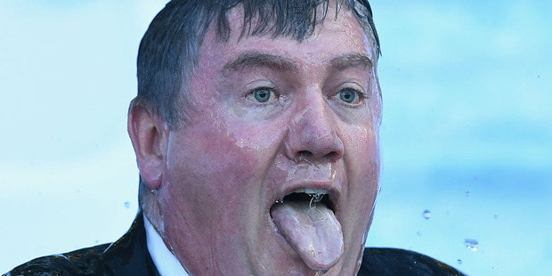 Eddie McGuire goes down the slide and into the ice for Freeze MND during the round 12 AFL match between the Melbourne Demons and the Collingwood Magpies. Photo / Getty Images.