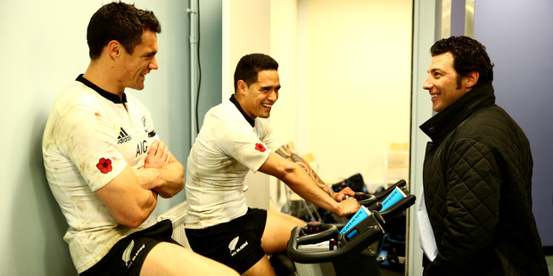 Kelleher, right, with Dan Carter and Aaron Smith in the All Blacks dressing room in Paris in 2013. Photo / Getty Images