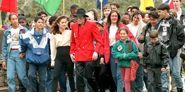 Pop superstar Michael Jackson, holding hands with his then-wife Lisa Marie Presley, walks with children at his Neverland Ranch in Los Olivos, California, 1995. Photo / Getty Images