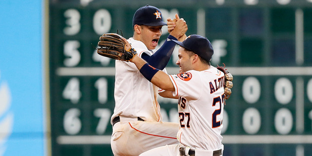 Jose Altuve and Carlos Correa celebrate Houston's 3-2 win over the Los Angeles Angels. Photo / Getty Images