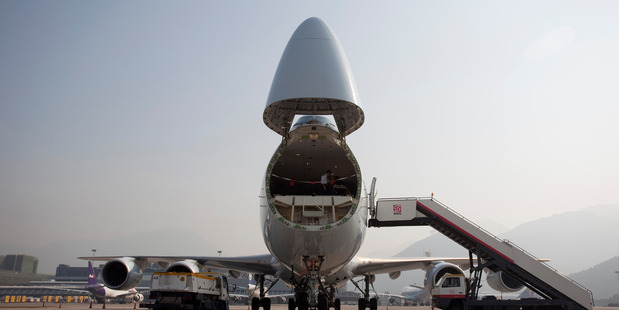 A Cathay Pacific Airways Boeing 747-8 freighter with the nose cargo door opened. Photo / Bloomberg