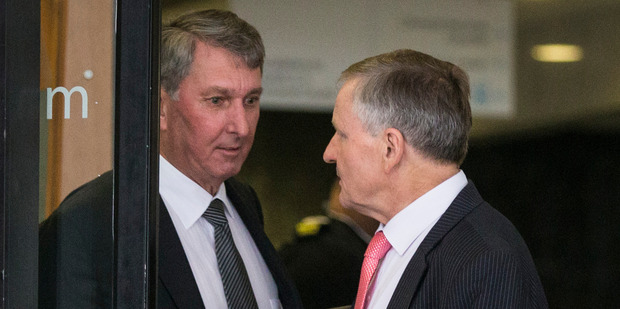 Michael Reid, left, leaves the Auckland District Court with his defence lawyer Kevin McDonald. Photo: Jason Oxenham