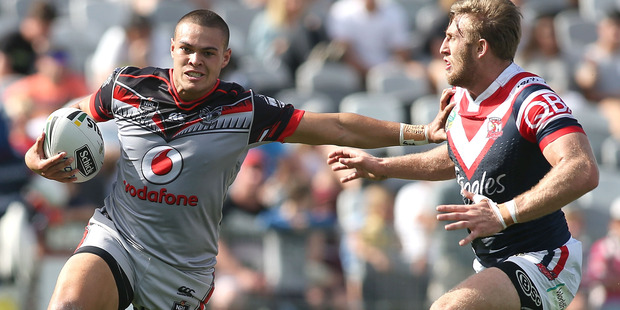 Warrior Tui Lolohea shows off his speed as he fends off a Roosters attack. Photo / Getty Images
