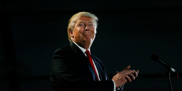 Republican presidential candidate Donald Trump smiles while speaking during a rally. Photo / AP