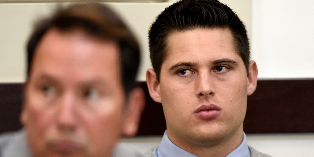 Brandon Vandenburg, right, a former Vanderbilt football player, listens during his retrial. Photo / AP