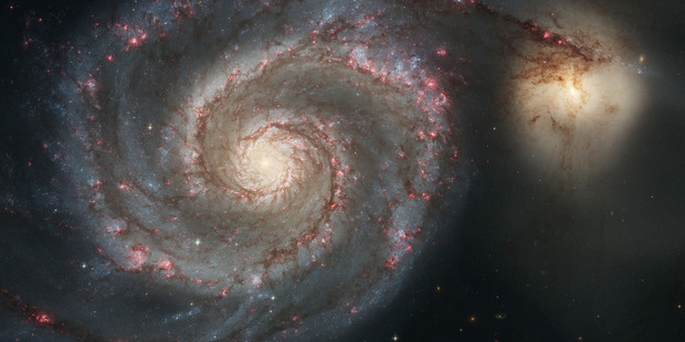 the Whirlpool Galaxy and a companion galaxy. Photo / AP