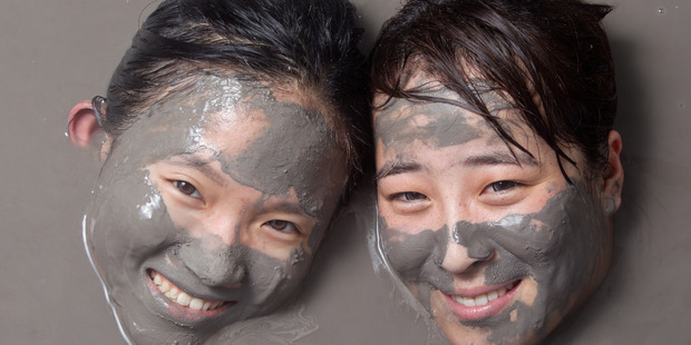 Nicole Zheng, left, and Sherry Liu, from China at Hell's Gate thermal mud pools. Rotorua's mud will be the focus of a new festival revealed for the city. Photo/file